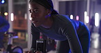 Ebike, fitness and woman in gym, wellness and cardio with challenge, sweating and energy. Person, exercise bicycle and athlete in health center, goals and body workout with endurance or weight loss