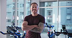 Face, athlete and man with arms crossed, gym and confident for bodybuilding, smile or determination. Happy, bodybuilder and person with pride for strength, muscles and wellness in fitness center