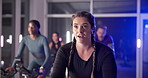 Cycling, class and woman in gym on machine for cardio workout, exercise and training for strength. Sports trainer, health club and people on bike for endurance, fitness and challenge for wellness