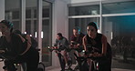 Bike, exercise and group with people in spin class for cardiovascular improvement or cycling at night. Fitness, performance and stationary spinning with athletes in gym for late evening challenge