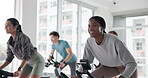 Woman, people and stationary bike in gym for fitness, cycling and cardio workout. Group, person and smile on bicycle machine of speed challenge, sports training and exercise performance in spin class
