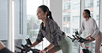 Woman, energy and exercise bike for people, training or body wellness for workout goal. Sport cycling, cardiovascular fitness and joint mobility for endurance, gym and equipment for spin class