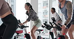 Stationary bike, people and woman in gym, fitness and cardio with body workout, energy and smile. Person, group and athlete in wellness center, exercise machine and challenge with health and training