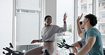 Applause, fitness and high five with friends in spin class for cardio, motivation or support. Bike, cycling and exercise with athlete people together in celebration of gym goals, milestone or target