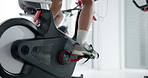 Bike, fitness and legs of person in spin class for cardio training, challenge or performance. Endurance, exercise and sneakers with feet of athlete in gym for indoor cycling or stationary workout