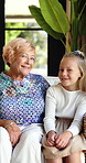 Relax, face or grandma with girl in home for love, hug or bonding together in retirement. Portrait, senior woman or happy mother in lounge with support, security or smile with kid in family house