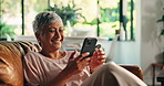 Phone, relax and smile with mature woman on sofa in living room of home for social media browsing. App, connection and wellness with person in apartment for internet search or typing text message