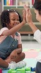 Therapist, high five and girl with building blocks, kid and support with help, appointment and motivation. Psychology, client or child development with toys, hand gesture or pediatrics with progress 