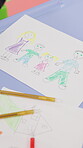 Classroom, paper and creative drawing on table for art lesson, family sketch or learning assessment. School, coloring activity and illustration for fine motor skills, educational development or craft
