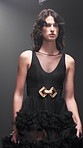 Girl, runway and model for fashion, show and evening gown with confidence, design and style expo. Woman, couture clothes and stage with garment collection on catwalk, trend and audience at event