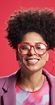 Happy, dance and face of woman in studio for winning a store discount, sale and bargain. Excited, yes and portrait of person with glasses, style and reaction for fashion news on red background