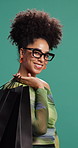 Woman, shopping bag and happy with face in studio, deal or sale for fashion by background. Person, happy and glasses with package for product, retail therapy and discount with clothes in Colombia
