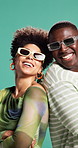 African couple, sunglasses and arms crossed in studio with smile, fashion or confident by background. People, woman and man with trendy clothes, laugh and happy with back for pride in relationship