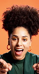 Woman, face and point at you in studio for smile, excited or call to action for discount by orange background. Person, happy and portrait for sign, sale and choice for deal with symbol in Brazil
