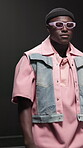 Fashion model, man and walk with sunglasses on runway for style showcase, couture or designer brand. Catwalk show, audience and trendy wardrobe on stage for clothes collection, menswear or confidence