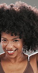 Woman, afro and face with hairstyle in studio for touch, texture and confidence by background. Mature person, smile and excited for results, change and portrait with growth for hair care in Brazil