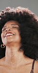 Shake, beauty and afro with black woman in studio for curl pattern, natural texture and growth. Shampoo cosmetics, volume and glow with person on gray background for salon treatment and shine