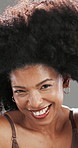 Woman, afro and happy for hair care in studio for touch, texture and eyes closed by background. Mature person, smile and excited for results, change and transformation with growth for hairstyle