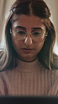Woman, laptop and education with thinking in home for typing, study or elearning for university test. Girl, pc and glasses with assessment, college and online course with problem solving in house