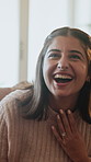 Woman, laugh and watching tv on sofa in home with streaming, standup comedy and funny film in lounge. Person, girl and relax with television, subscription and comic movie in living room at house