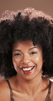 Face, black woman and laugh with skincare in studio for beauty, natural and facial treatment. Portrait, female person and afro for dermatology benefits, cosmetic wellness and glow on brown background