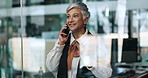 Business, window and woman in workplace, phone call and communication with investor. Mature person, happy employee or consultant in office, cellphone and profit increase with feedback, app or contact