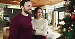 Happy couple, christmas or tree with hug for celebration or christian holiday together at home. Man, woman or lovers with smile, embrace or bonding with ornaments for december or festive decorations