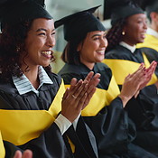 Graduation, clapping and happy group of people at university ceremony ...