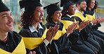 Graduation, clapping and happy group of people at university ceremony for success, education or praise. College, graduate and students applause for achievement, celebrate award and accomplishment
