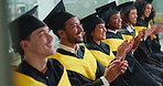 Man, graduation and applause with smile in row for education, achievement and goals at college. People, happy and students with success, cheers and excited for celebration ceremony at university