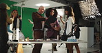 Film, makeup and tablet with director on set for advertising, production or videography success. Conversation, green screen or styling with man and talent in studio for behind the scenes direction