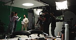 Filming, producer and broadcast with people in studio for news anchor, production and record. Weather forecast, television and journalist media with cameraman and green screen on set for rehearsal