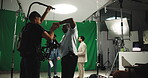 Filming, green screen and broadcast with people in studio for news anchor, production and record. Weather forecast, television and journalist media with cameraman and producer on set for rehearsal