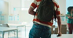 Student, leave and finished in classroom with backpack for education, scholarship or learning. Back view, people and done in academy for home time, end of day or class break for last semester