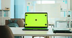 Laptop, green screen and mockup in office for business website on desk with tracking markers. Computer, workspace and display for marketing, advertising and branding with information on internet