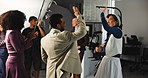 Happy people, director or production team with high five in celebration for filmmaking on set. Excited group, actor or cast with videographer or camera for success or video commercial in studio
