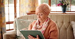 Surprise, tablet and relax with old woman on sofa for bingo app, online game or connection. Jackpot prize, virtual dealer and digital cards with elderly person in home for retirement and gambling