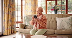 Home, happy or old woman with phone for joke for internet, texting or social media on technology. Relax, network or senior female person with funny meme for online search, chat or digital website