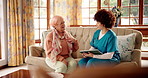 Tablet, senior woman and consultation with nurse in home for healthcare, chest pain or help. Caregiver, retirement and person with checkup for medical symptoms or hearing loss with disease diagnosis