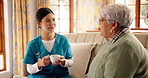 Nurse, old woman and conversation with coffee on sofa for counselling session in retirement home. Caregiver, elderly person and talk with tea, listen and story with assisted living services in house