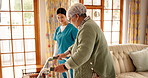 Assisted living, retirement and walker with people in apartment for senior care or rehabilitation. Nurse, old woman with disability and walking frame in home for assistance or recovery from injury