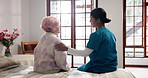 Comfort, consultation and nurse with senior woman for medical advice, support or assessment. Checkup, retirement and caregiver with elderly female patient in bedroom for assistance in nursing home