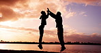 High five, jump and sunset with fitness couple outdoor together for training goals or target. Excited, silhouette and success with athlete people in nature for bonding, exercise or workout motivation