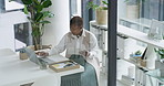Tablet, laptop and black woman in office for research on finance report, proposal or account. Technology, typing and African female financial manager with investment planning for company in workplace