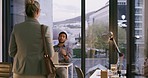 Positive, happy and excited business woman gets a promotion in her boss's office and yells in happiness as she leaves. Female worker receives good news from team leader and pumps her fists in the air