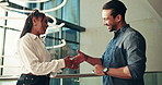 Happy, business people and tablet with handshake for partnership, deal or teamwork at office building. Businessman, woman or colleagues shaking hands with smile for b2b app, agreement or thank you