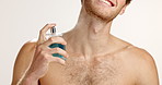 Neck, hands and man spray perfume for hygiene, grooming or fragrance on white studio background. Cologne, fresh scent or happy model with cosmetics product for body care,  odor mask and smell clean