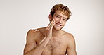 Face, beard and man with cosmetics, beauty and dermatology on studio background. Portrait, person and model with grooming, healthy shine and skincare with confidence, hair care and wellness 