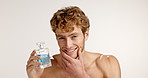 Face, happy man and perfume in studio for beauty, grooming and fragrance on white background. Cologne, fresh scent and model with cosmetics product for self care, skincare and confident with space