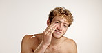 Face, cream and man with cosmetics, skincare and dermatology on studio background. Portrait, happy person and model with grooming, creme and beauty with wellness, moisturizer and aesthetic with glow